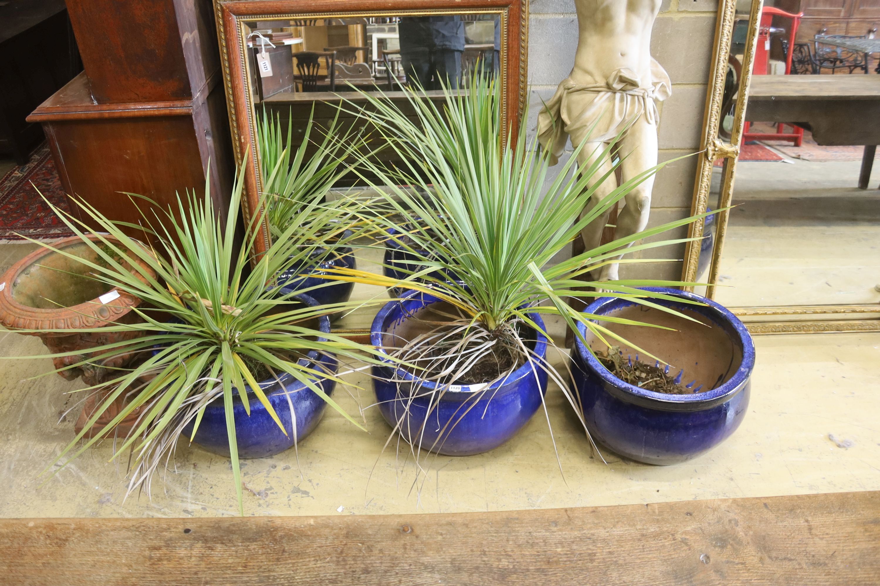 A set of three circular blue glazed garden planters, diameter 52cm, height 34cm
